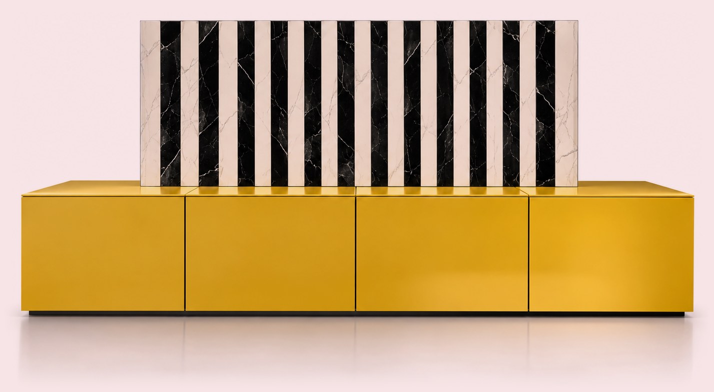 Yellow low cabinet beneath a black and white striped marble element
