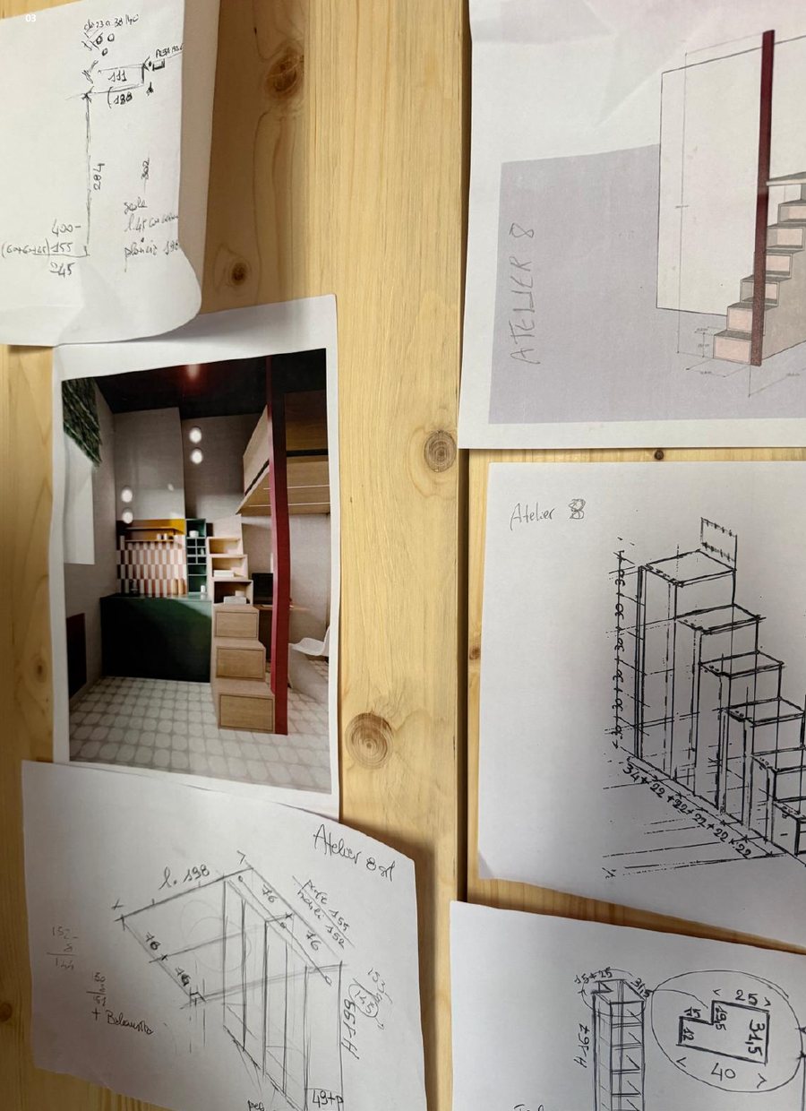 Hand sketches of a stair and a studio flat pinned to a board
